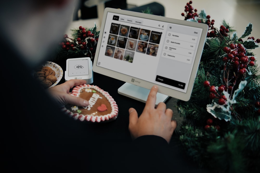 A vibrant Christmas display with a SumUp point of sale system, a decorated gingerbread cookie, and festive greenery, perfect for seasonal shopping vibes.